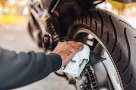 Wiping down motorcycle chain